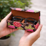 artisan batik sunglass case holding sunglasses