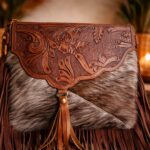 close up embossed leather detail boho trail sling bag