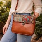 Woman carrying handcrafted Zardozi Sling Bag crossbody style