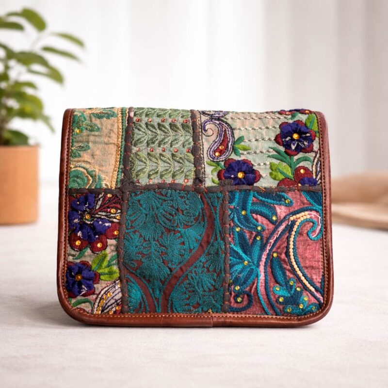 Back view of handcrafted Zardozi Sling Bag with colorful embroidered fabric